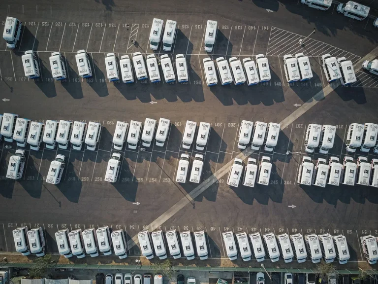 fleet vehicle disposal services aerial view of parked delivery vans