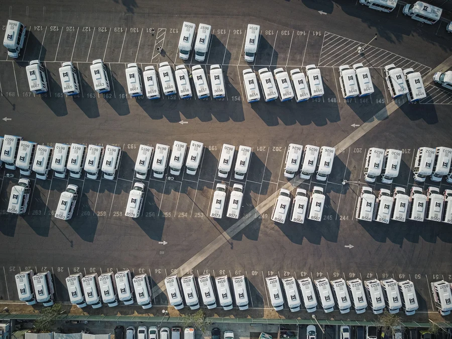 fleet vehicle disposal services aerial view of parked delivery vans